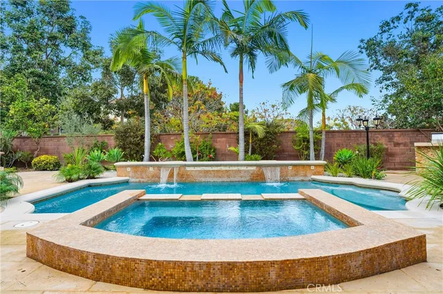 a view of swimming pool with a yard