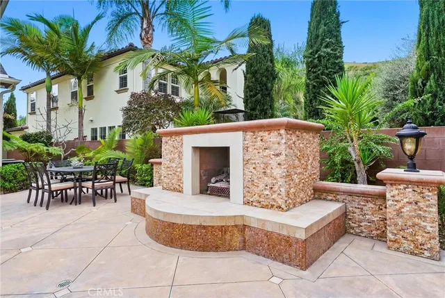 a view of a dinning table and chair in the patio
