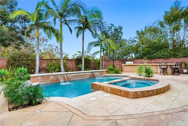 a view of a swimming pool with a yard