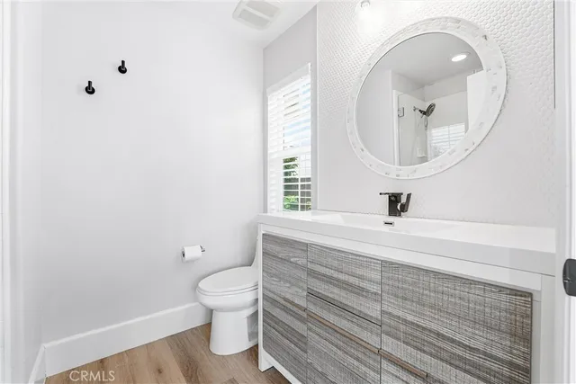 a spacious bedroom with a large bed and a window