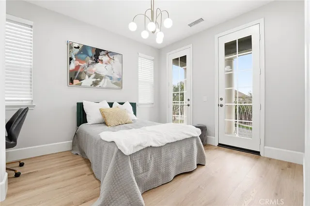 a bathroom with a granite countertop sink toilet a mirror and shower