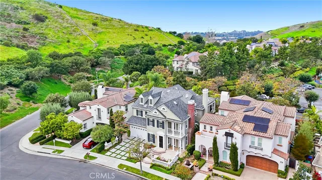 an aerial view of a house with a garden and plants