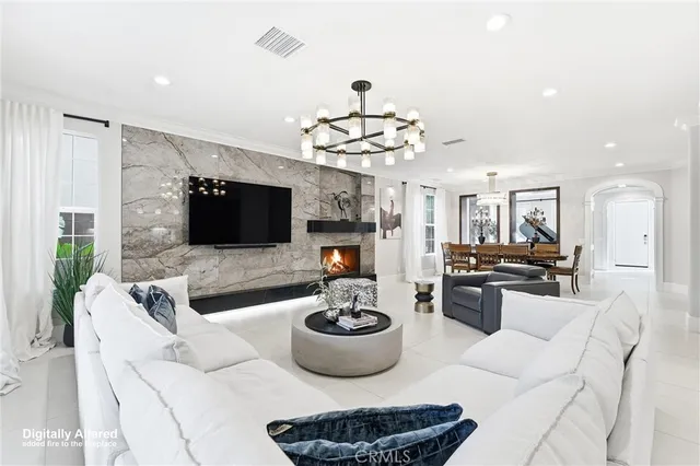 a living room with fireplace furniture and a flat screen tv