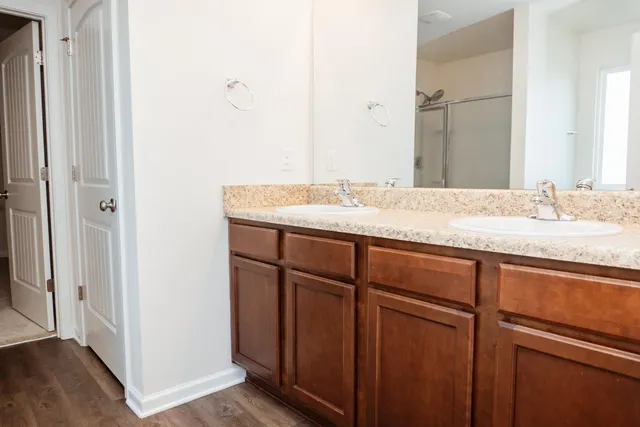 a bathroom with a glass shower door