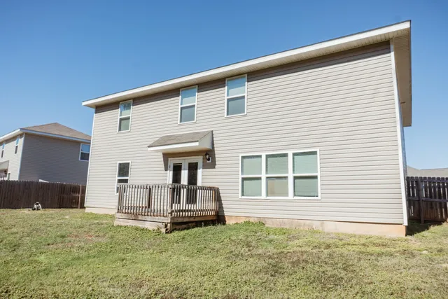 a front view of a house with yard