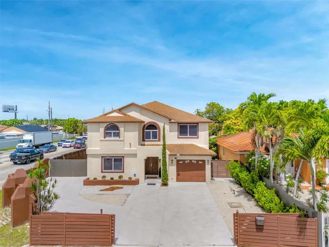 a view of house with outdoor space and sitting area