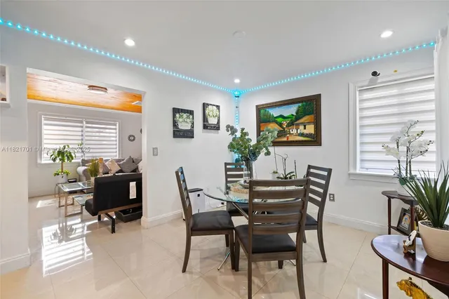 a view of a livingroom with furniture and a potted plant