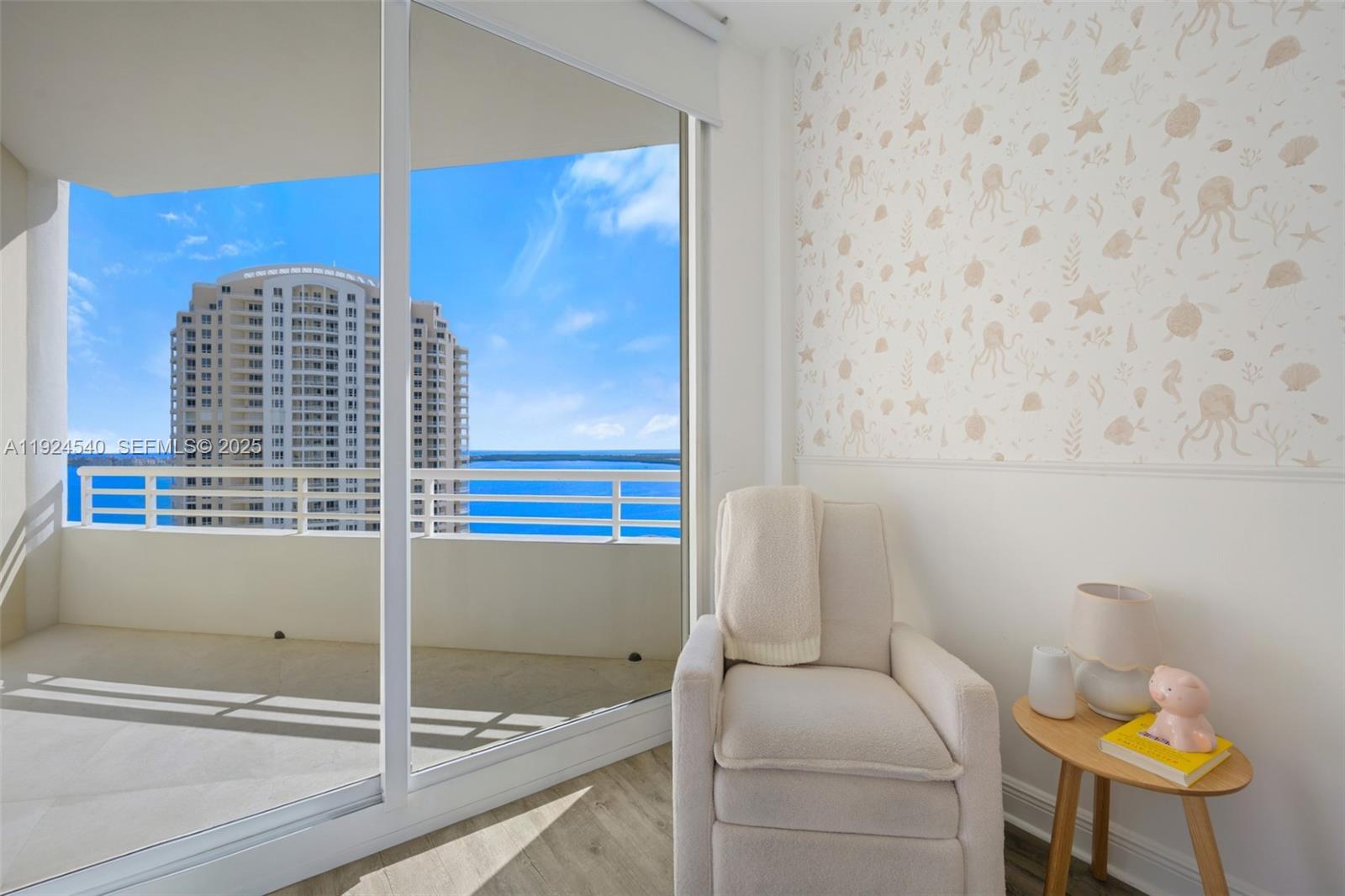 888 Brickell Key Drive, Unit 2909 Miami, FL 33131 - Photo 18 of 24 a bathroom with a sink and a mirror