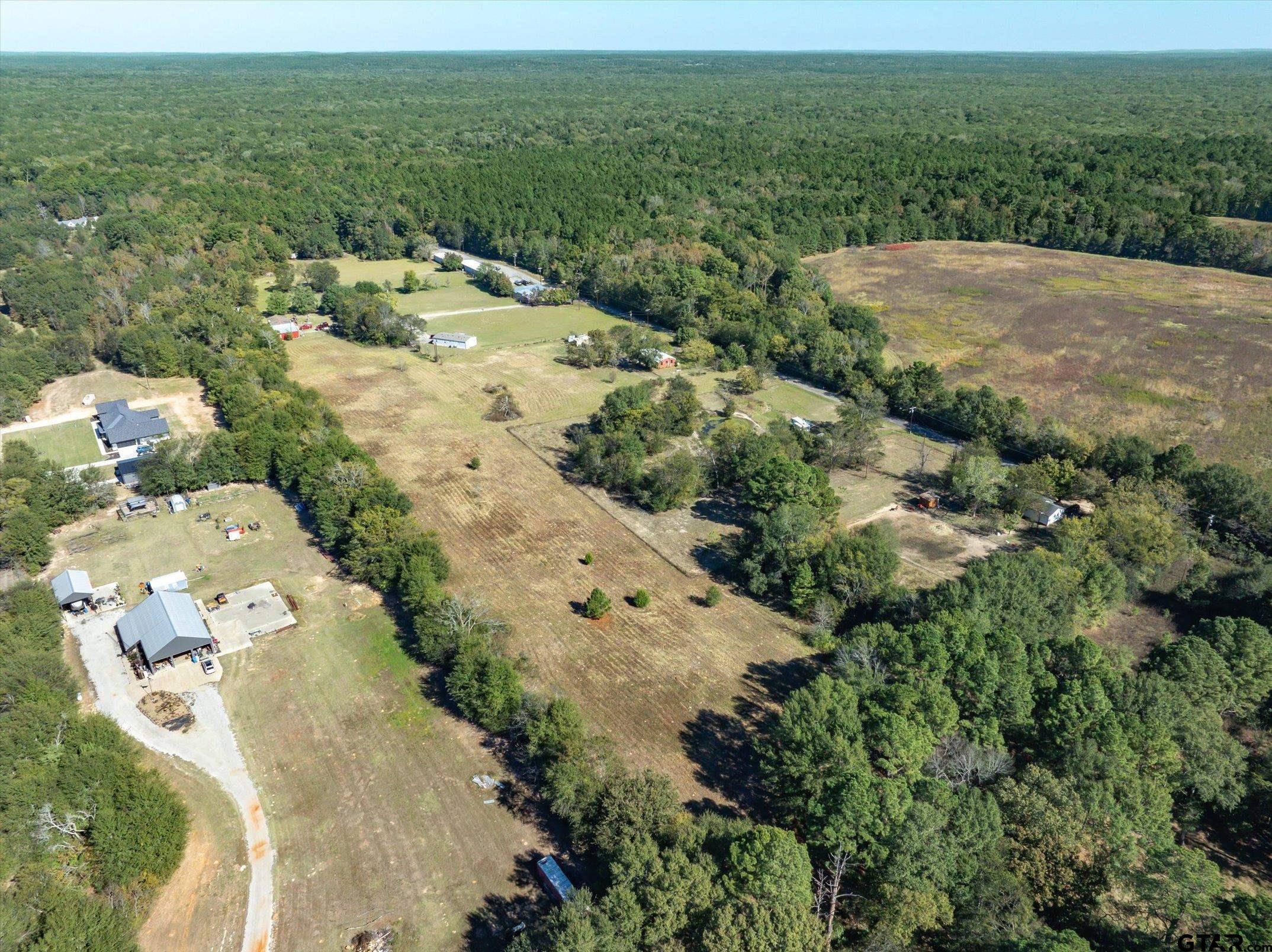 21151 C R 4106 Lindale, TX 75771 - Photo 11 of 12 an aerial view of a house with yard