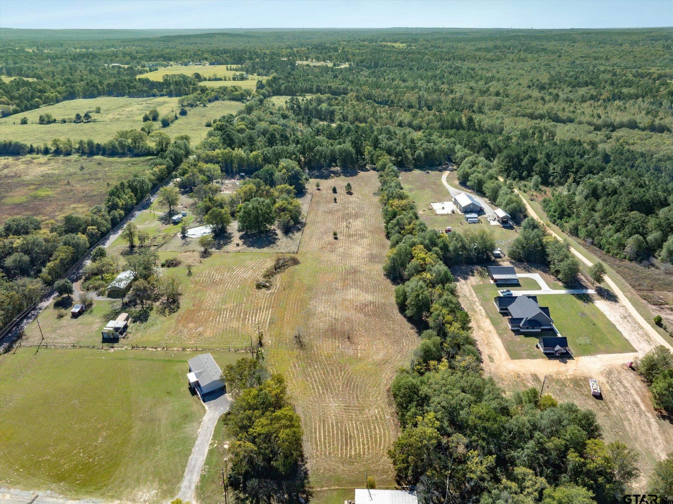 21151 C R 4106 Lindale, TX 75771 - Photo 6 of 12 an aerial view of residential houses with outdoor space