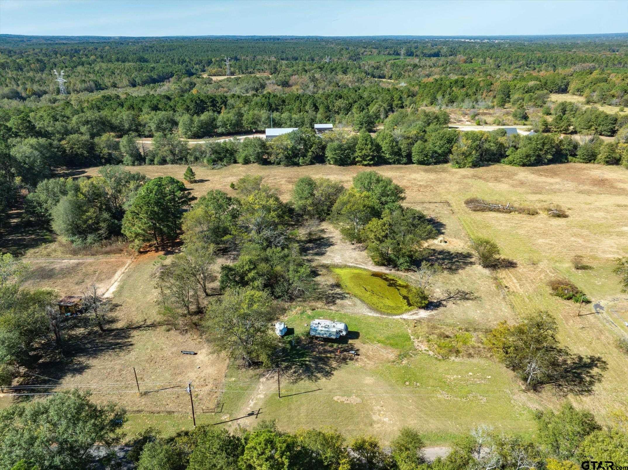 21151 C R 4106 Lindale, TX 75771 - Photo 8 of 12 a view of a lake with mountains