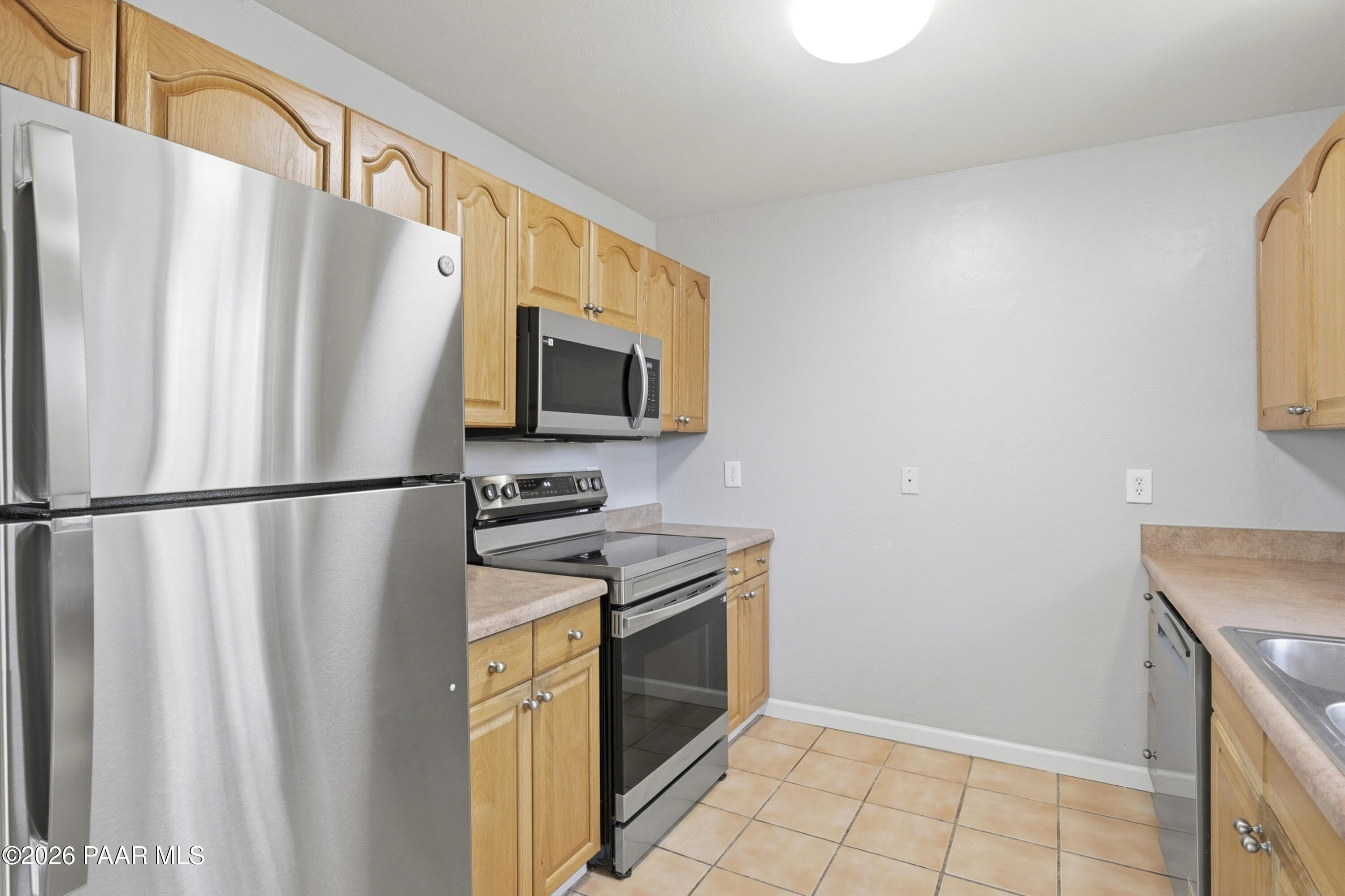 1775 Grandview Road Prescott, AZ 86305 - Photo 14 of 42 a kitchen with stainless steel appliances a refrigerator a stove a sink and dishwasher
