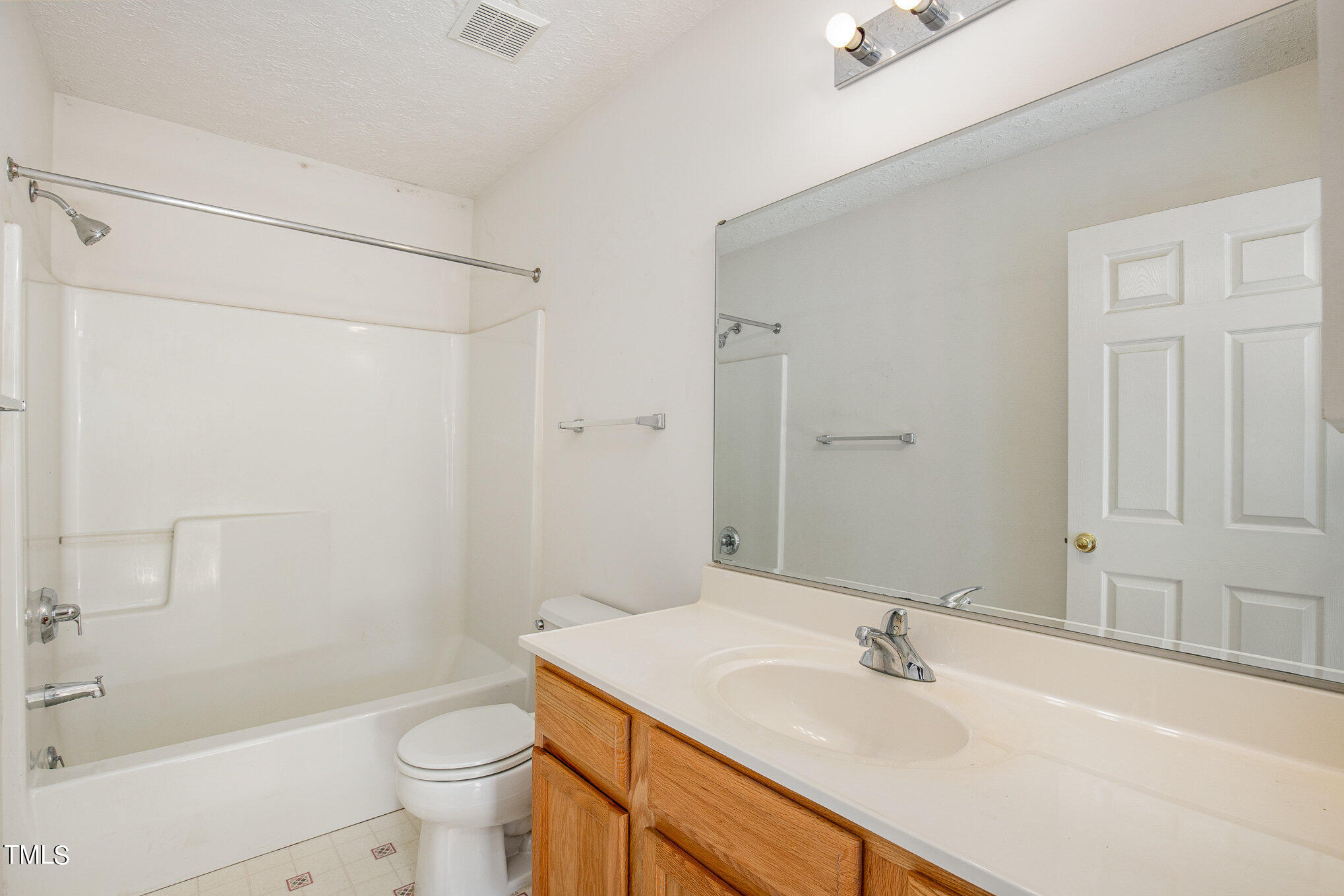 424 Henry Baker Road Zebulon, NC 27597 - Photo 17 of 26 a bathroom with a sink toilet and shower