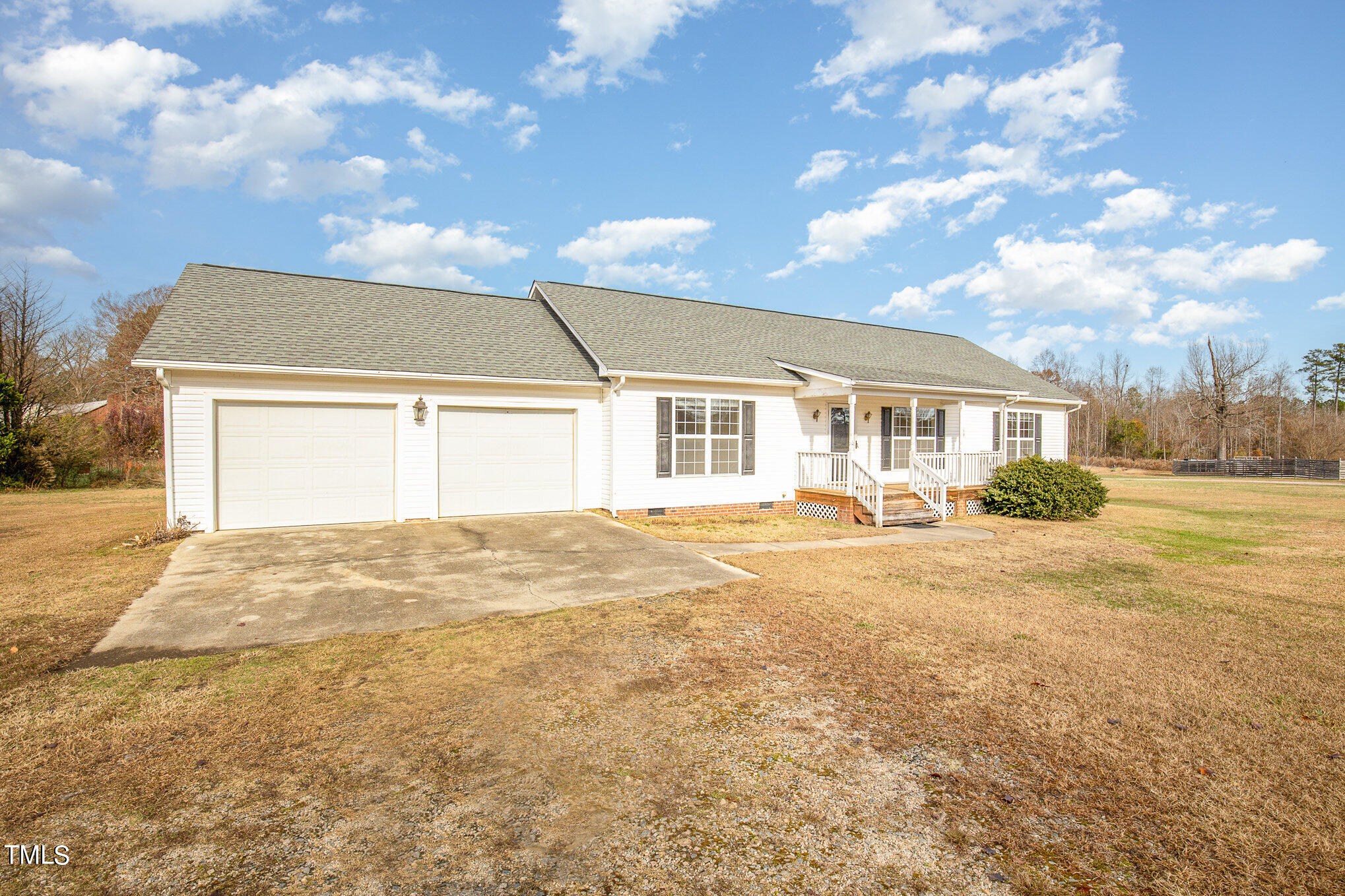 424 Henry Baker Road Zebulon, NC 27597 - Photo 2 of 26 a view of a house with a backyard and a tree