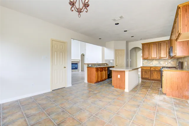 a kitchen with stainless steel appliances a refrigerator and a sink