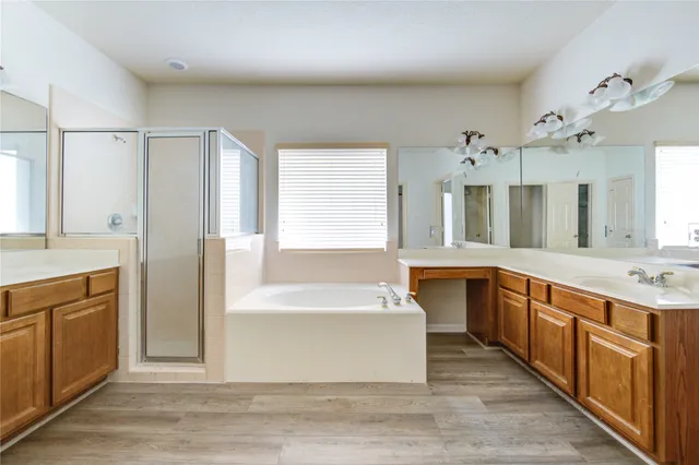 a large white kitchen with a large window
