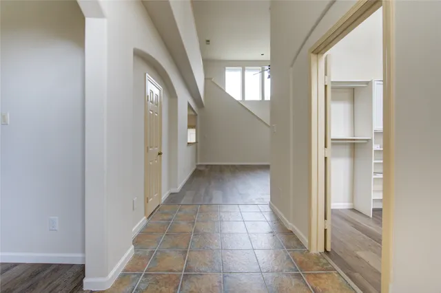 a view of an entryway with wooden floor