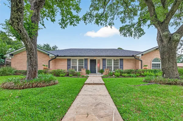 a front view of a house with yard