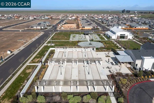 an aerial view of a residential apartment building with parking space
