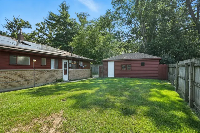 a view of a house with a back yard
