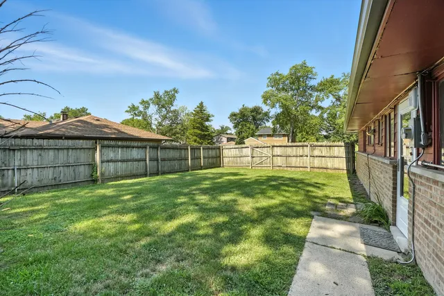 a view of backyard with green space