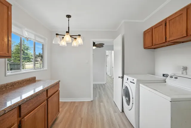 a view of a kitchen with washer and dryer