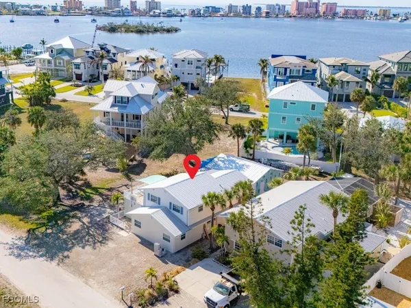 an aerial view of residential houses with outdoor space