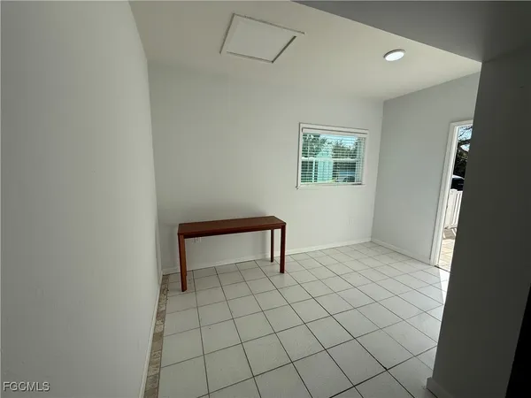 a view of an empty room and window