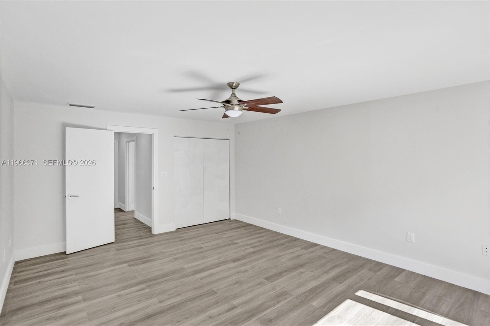 12020 Southwest 93rd Street Miami, FL 33186 - Photo 20 of 42 a view of a room with wooden floor