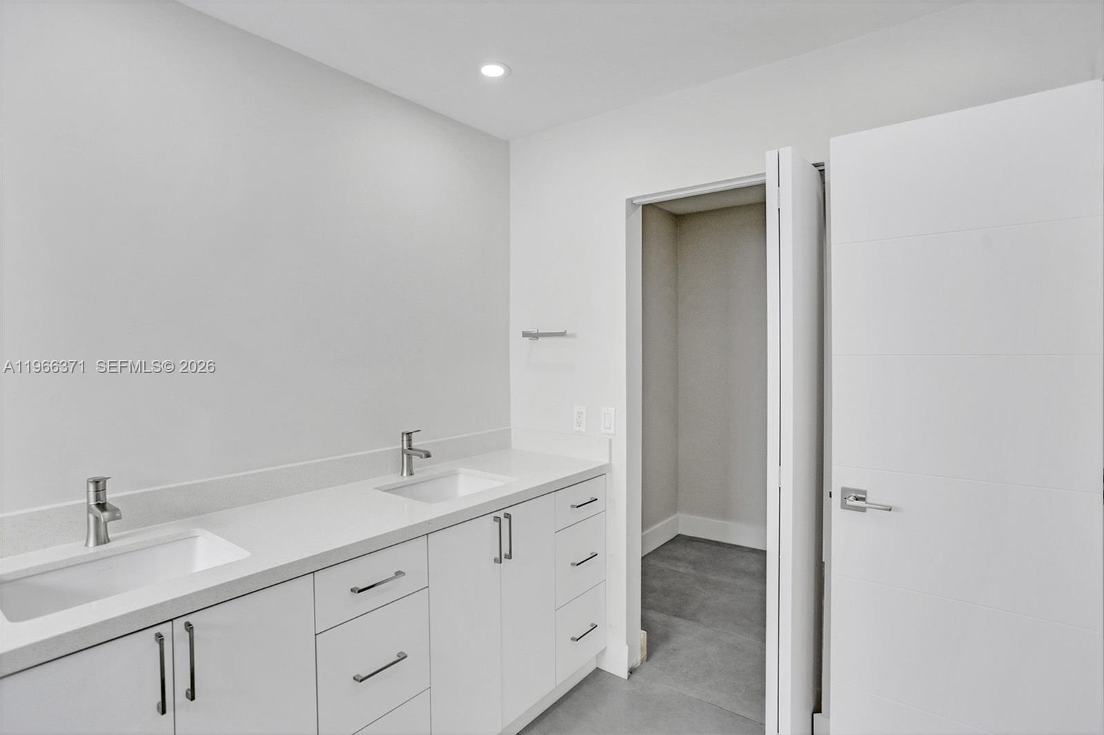 12020 Southwest 93rd Street Miami, FL 33186 - Photo 23 of 42 a en suite bathroom with a granite countertop sink and a mirror