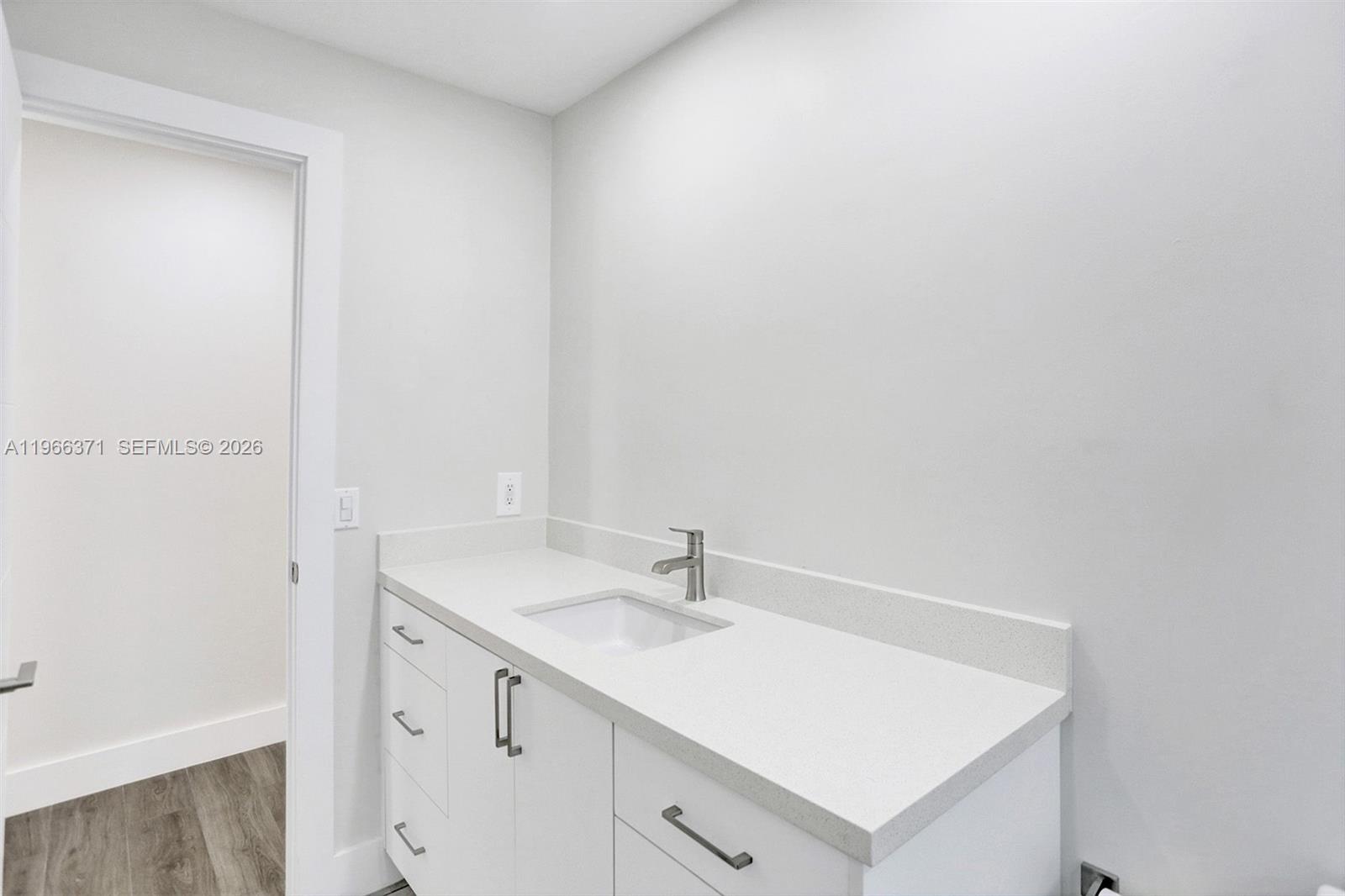 12020 Southwest 93rd Street Miami, FL 33186 - Photo 32 of 42 a bathroom with a sink and a mirror