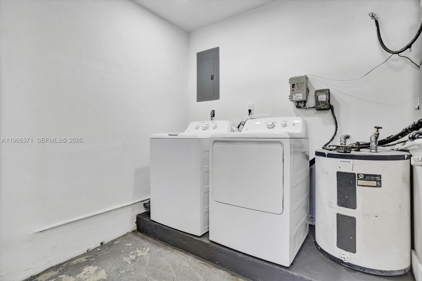 12020 Southwest 93rd Street Miami, FL 33186 - Photo 33 of 42 a utility room with dryer and washer