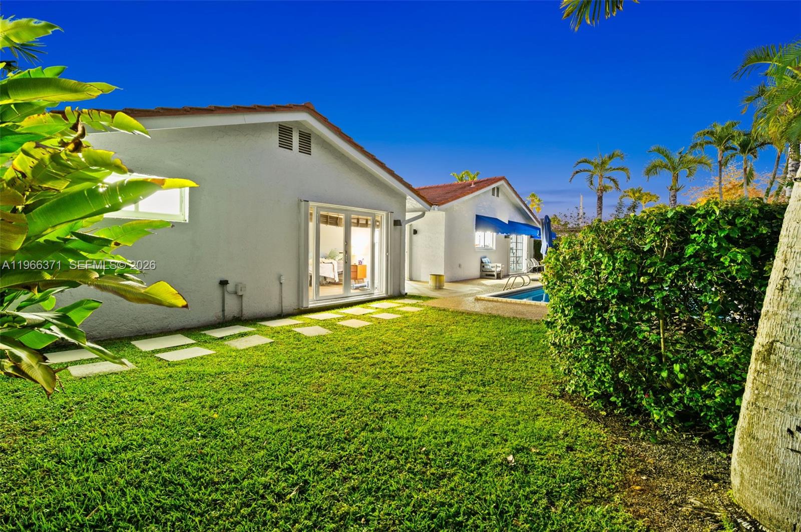 12020 Southwest 93rd Street Miami, FL 33186 - Photo 40 of 42 a front view of a house with garden