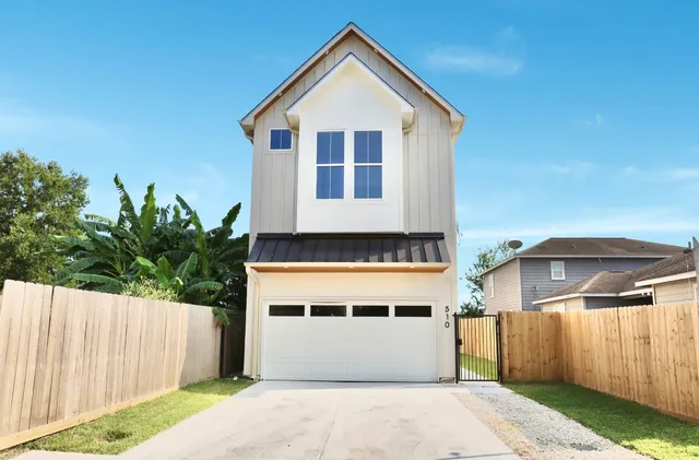 a front view of a house with a garage
