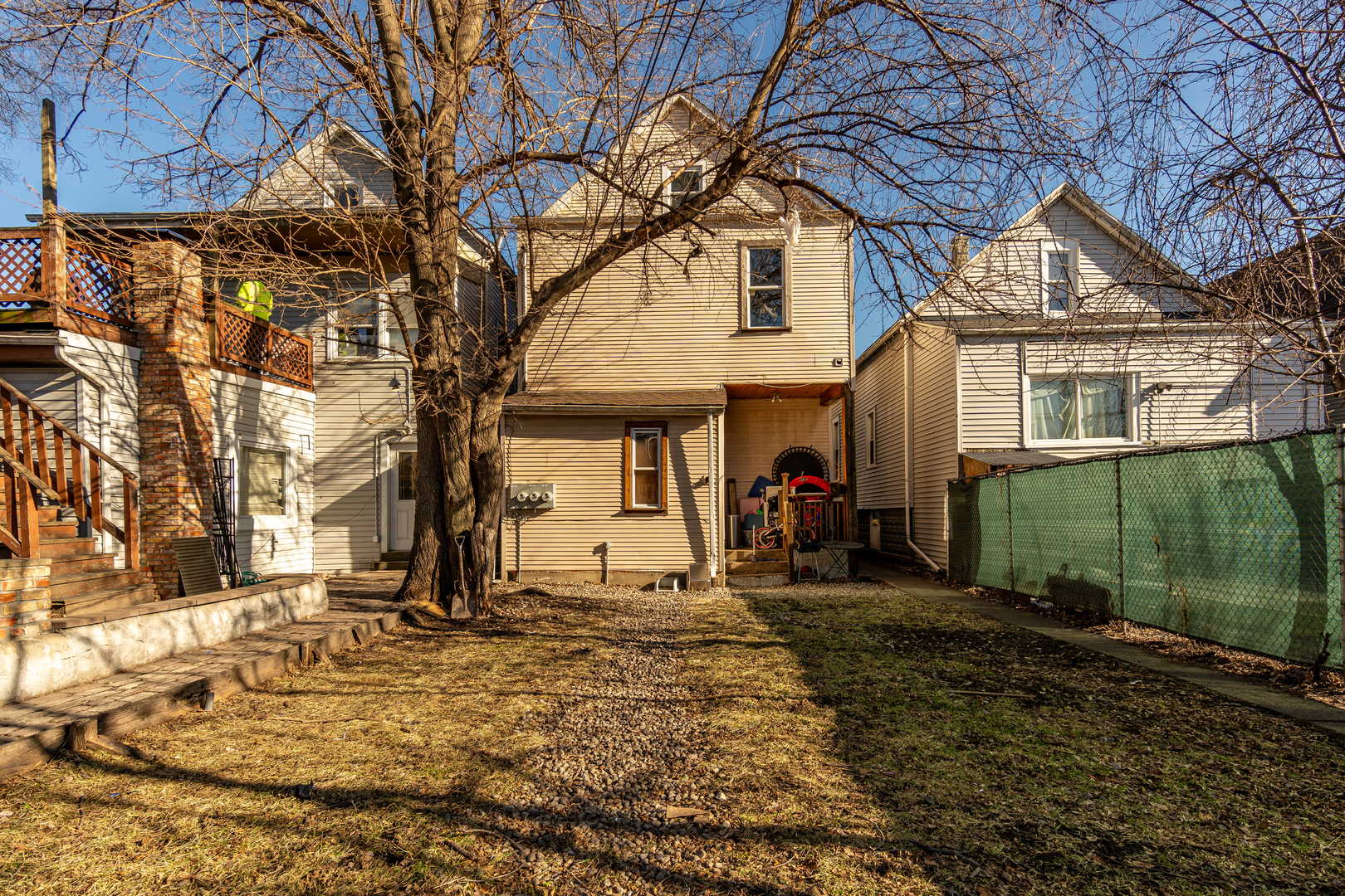 5230 South Justine Street Chicago, IL 60609 - Photo 13 of 15 a view of a house with a yard covered with snow