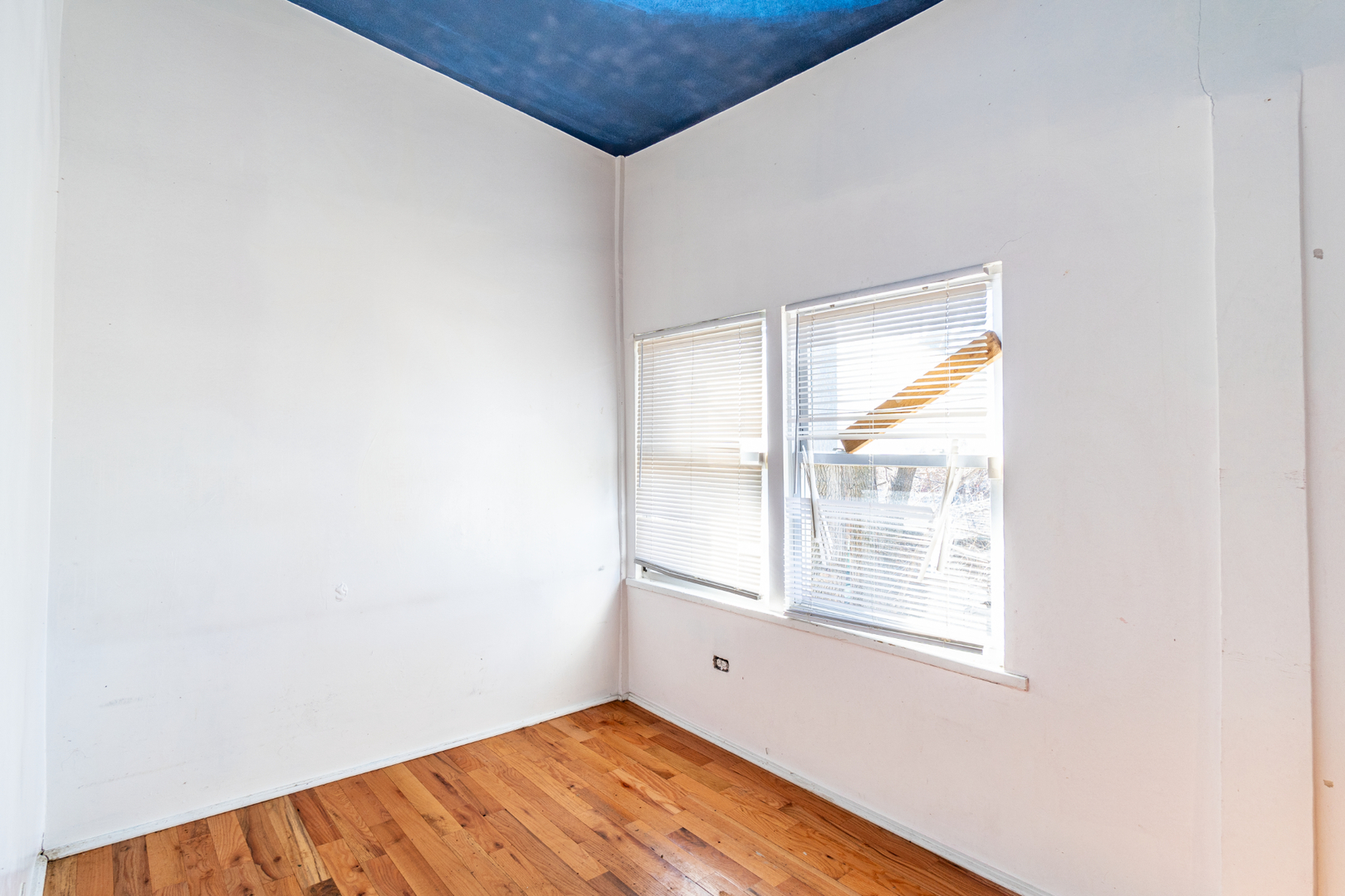 5230 South Justine Street Chicago, IL 60609 - Photo 7 of 15 a view of an empty room with wooden floor and a window