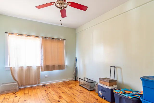 a view of a room with window and cabinet