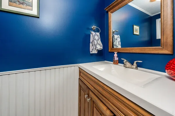 a bathroom with a sink and a mirror