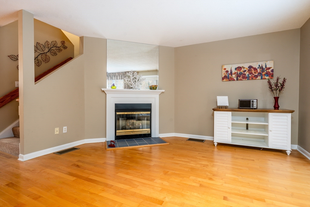 121 S Shellback Way, Unit 121 Mashpee, MA 02649 - Photo 10 of 23 a view of workspace with furniture and fireplace