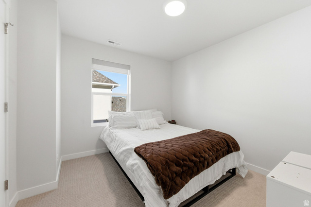 1038 South Old Towne Road Layton, UT 84041 - Photo 22 of 39 Carpeted room with a window, white walls, and a flush-mount ceiling light fixture