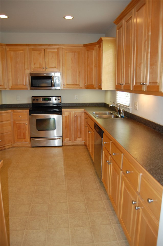 840 Nowell Ridge Road Raleigh, NC 27607 - Photo 6 of 25 Butler's Pantry to Kitchen View w/ , ample cabinetry & counter top space w/corner lazy susan/trundle! Kitchen