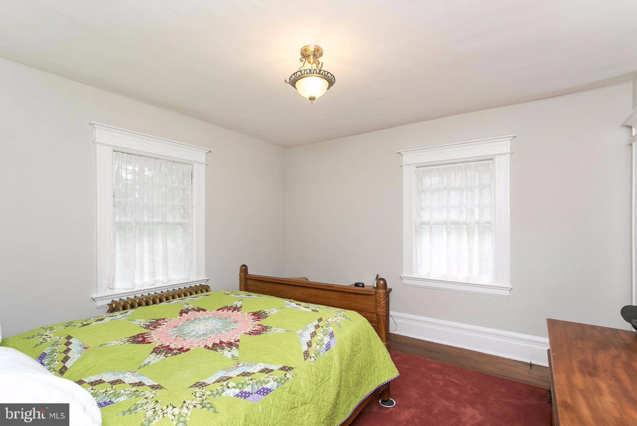 1 Midvale Road Baltimore, MD 21210 - Photo 17 of 30 a bedroom with a bed and a window