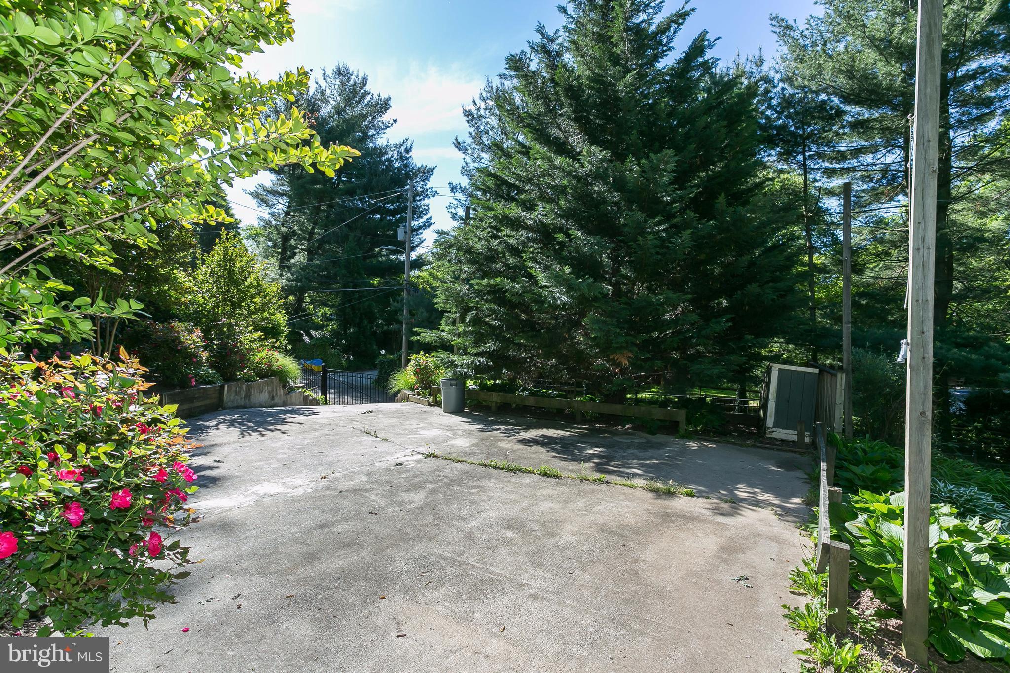 1 Midvale Road Baltimore, MD 21210 - Photo 30 of 30 a view of a backyard with potted plants and large trees