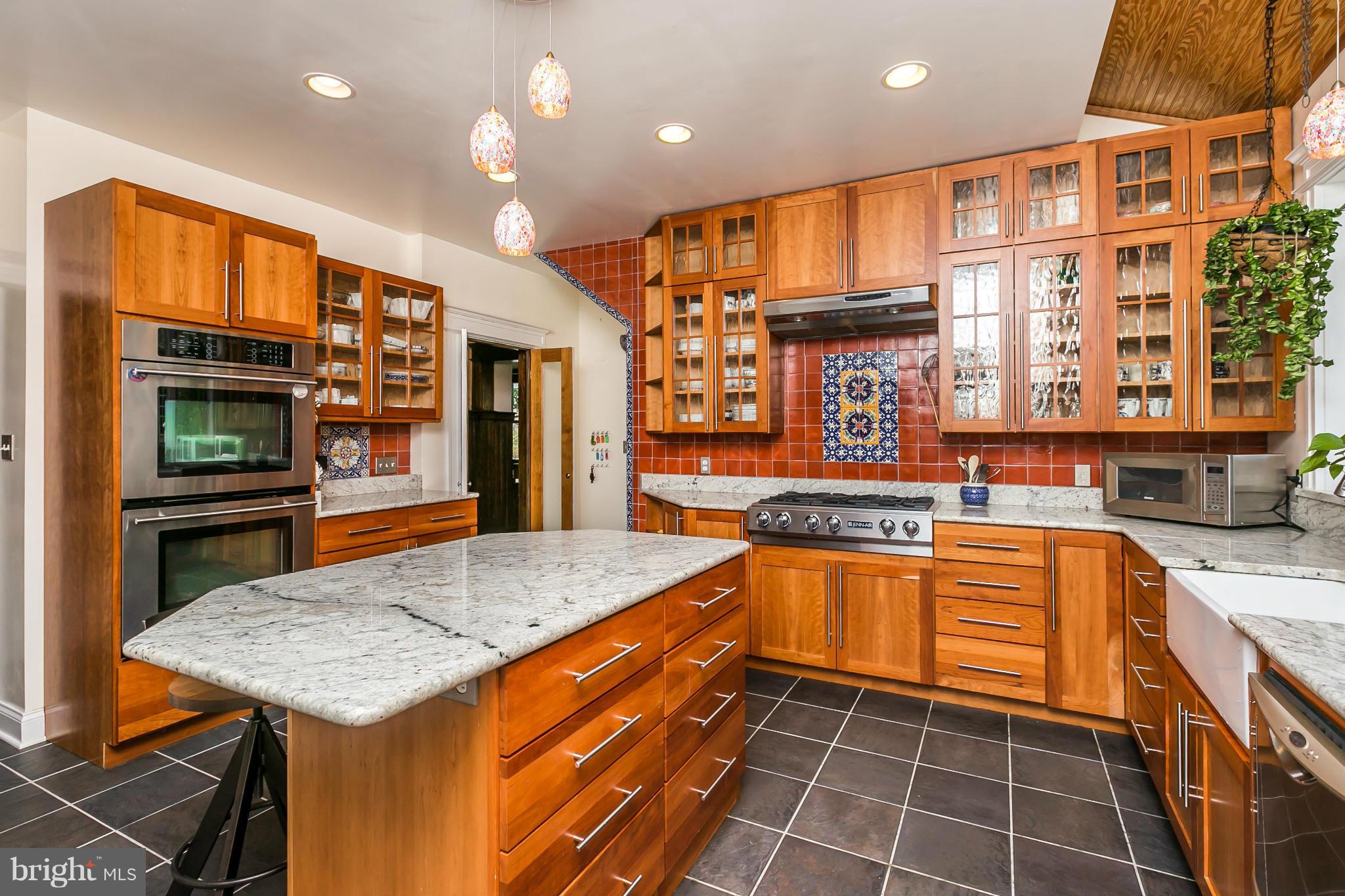 1 Midvale Road Baltimore, MD 21210 - Photo 10 of 30 a kitchen with stainless steel appliances granite countertop a stove a sink and a microwave
