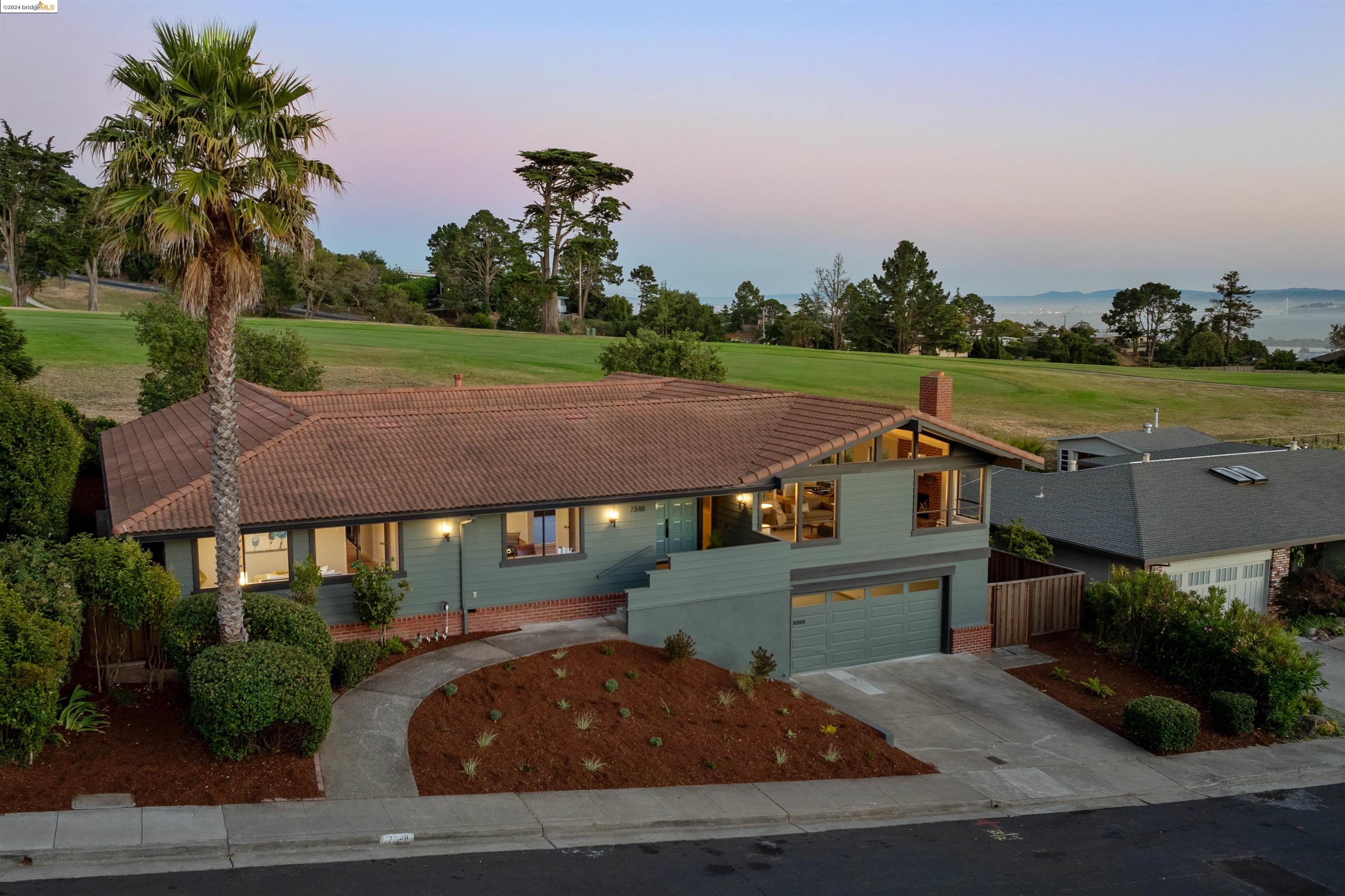 7348 Pebble Beach Drive El Cerrito, CA 94530 - Photo 1 of 1 an aerial view of a house with garden space and ocean view