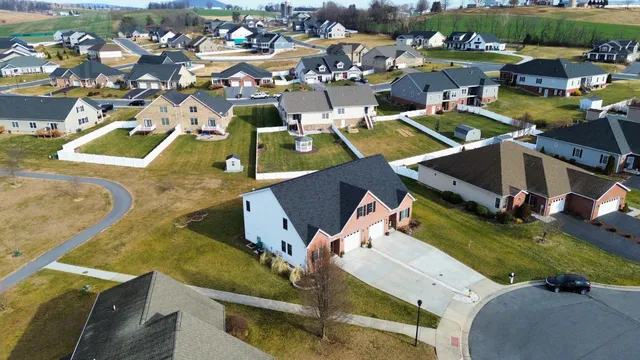 an aerial view of a house with a swimming pool yard and outdoor seating