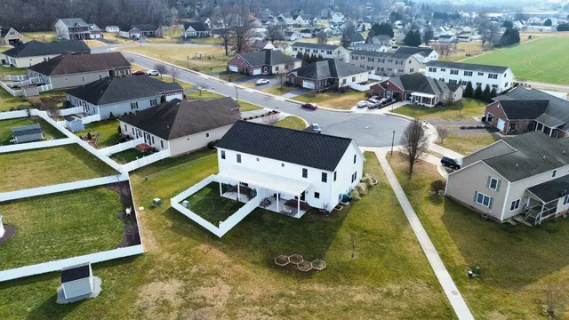 an aerial view of a house with a swimming pool