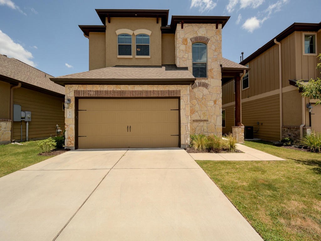 7337 Manchaca Road, Unit 11 Austin, TX 78745 - Photo 1 of 1 a front view of a house with a yard