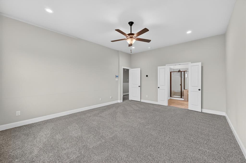 4224 Riverside Drive Flower Mound, TX 75028 - Photo 11 of 23 a view of an empty room with a ceiling fan