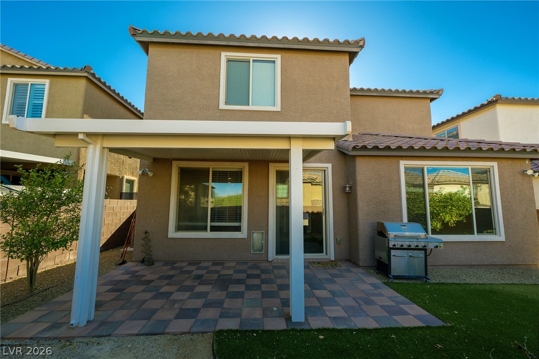 11016 Prairie Grove Road Las Vegas, NV 89179 - Photo 33 of 37 A private covered patio extends entertaining to the low-maintenance backyard.